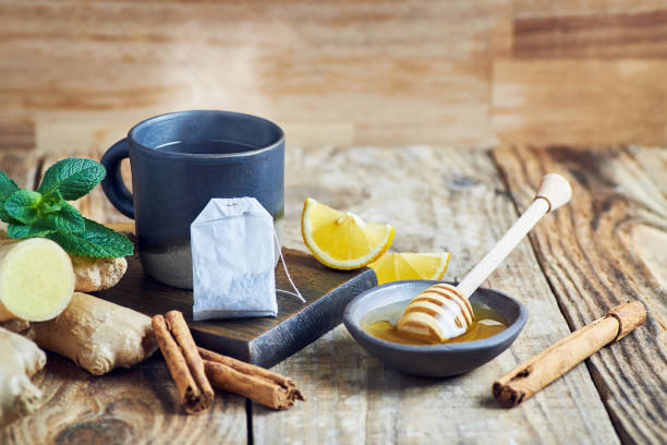 Tea cup served on wooden table.