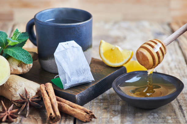istock Tea cup served on wooden table. 1383823442
