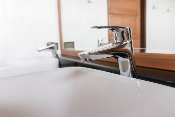 istock Stainless steel faucet, elegant sink. 1383823730