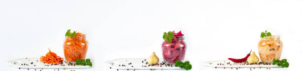 istock Fermented vegetables in jars banner isolated on white background 1383824239