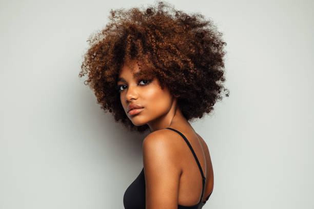 istock Beautiful afro woman with perfect make-up 1383828142