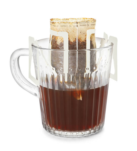 istock Glass cup with drip coffee bag isolated on white 1383828236