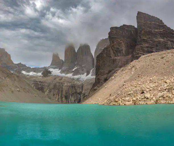 Photo of Lagoon at the base of the distinctive granite peaks of the Paine Massif, Torres del Paine National Park, Patagonia, Magallanes, Chile