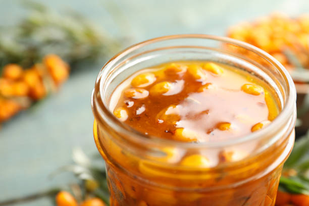 istock Delicious sea buckthorn jam in jar, closeup 1383830121