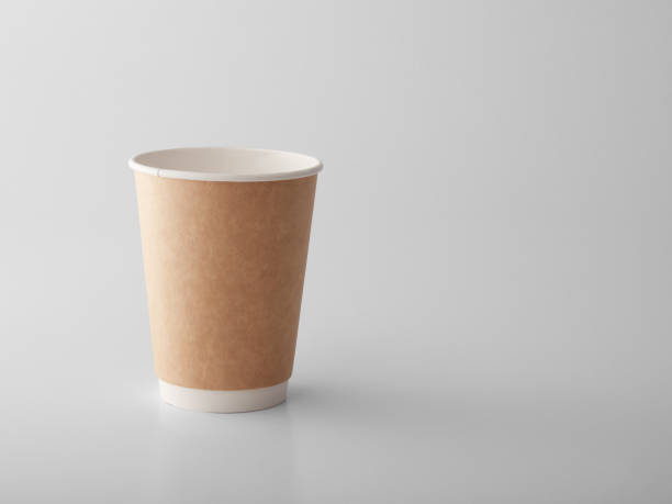 istock Brown takeaway paper cup on white background. 1383831010