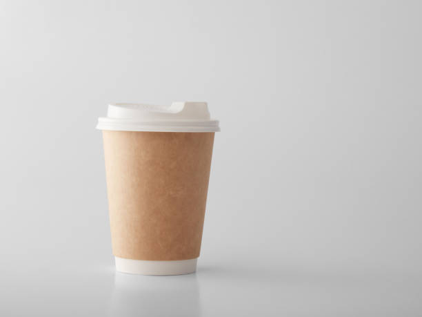 istock Brown takeaway paper cup on white background. 1383831013