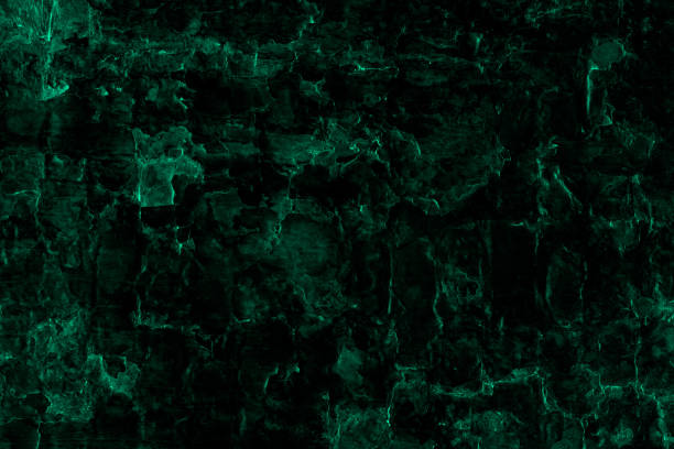 istock Dark green color seamless rough textured old abandoned stone wall surface for background 1383831806