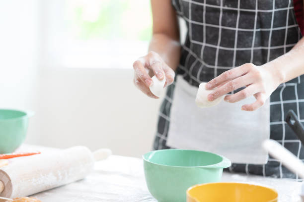 istock close up chef hands cracking fresh egg yolk and dropping in a bowl 1383833527