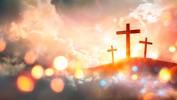 istock Crucifixion - Crosses At Sunset With Abstract Defocused Bokeh Lights 1383833827
