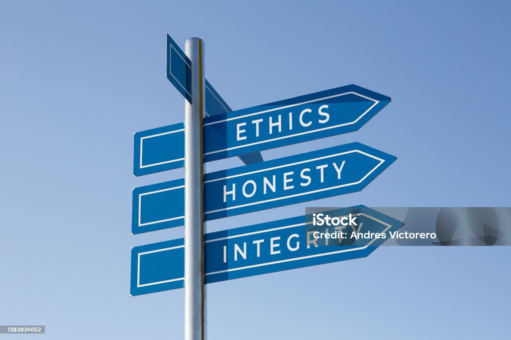 Ethics honesty integrity words on signpost Ethics honesty integrity words on signpost isolated on sky background Morality Stock Photo