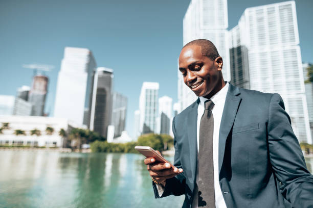 istock business man with smartphone in Miami 1383836405
