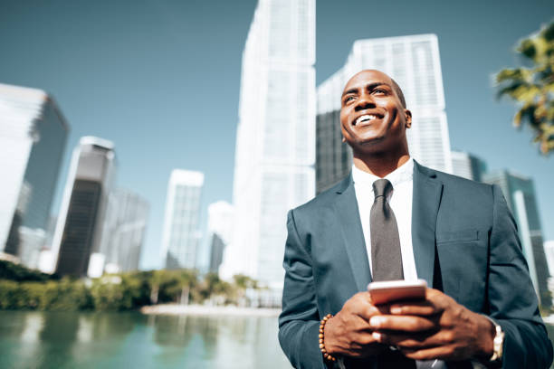 istock business man with smartphone in Miami 1383836599