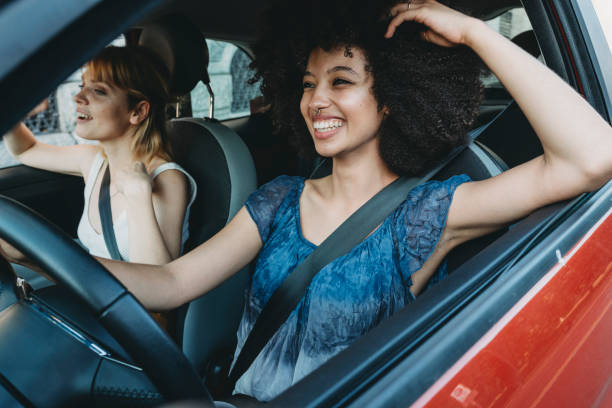 istock Two friends together in the car 1383836706