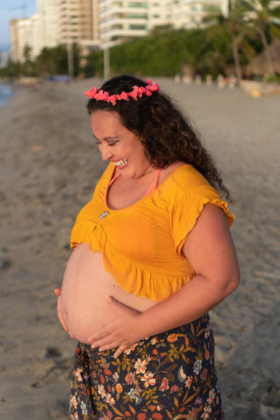 istock Pregnant Mom Holding Her Belly 1383836775