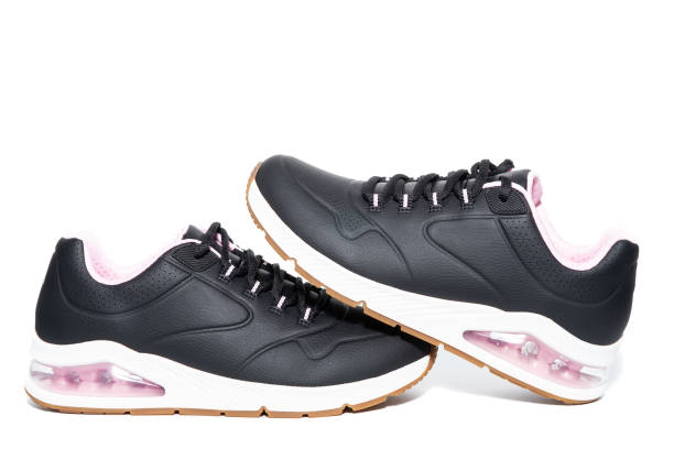 istock Black sneakers on an isolated background. 1383836925