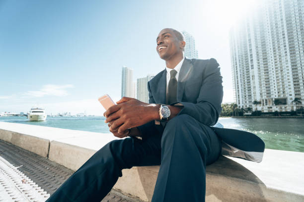 istock business man with smartphone in Miami 1383836953
