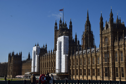 London, UK - February 25 2022: scaffolding on Houses of Parliament as renovation continues,