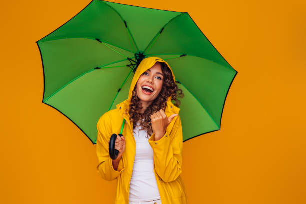 istock Girl with green umbrella 1383837825