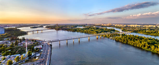 istock Dnieper with Petrovsky Railway Bridge in Kiev, Ukraine 1383840285
