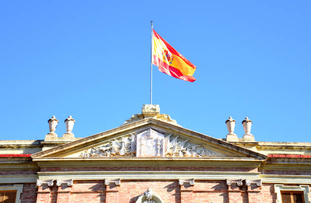 istock Spain flag on a building against a blue sky. 1383841851