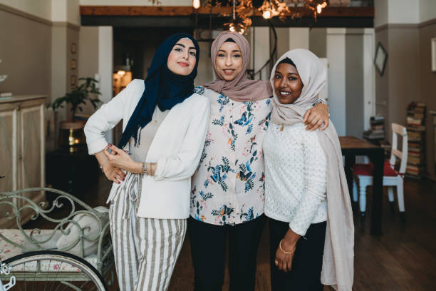 istock Portrait of three arab young women looking at camera 1383842075