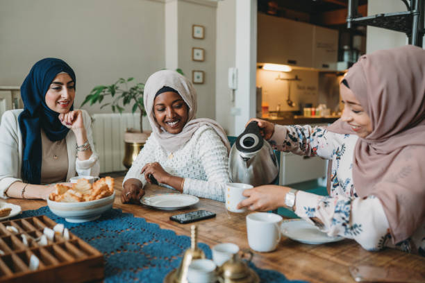istock Three friends having breakfast together at home 1383842080