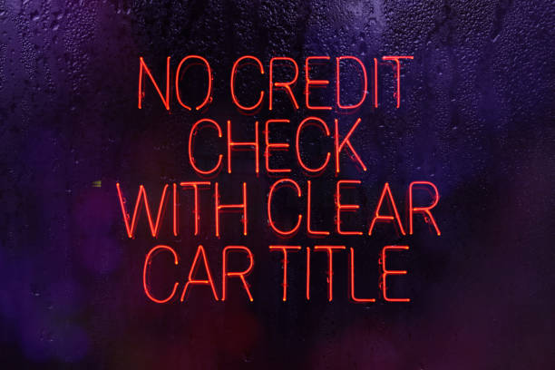 istock Neon Sign No Credit Check with Clear Car Title in rainy window 1383842761