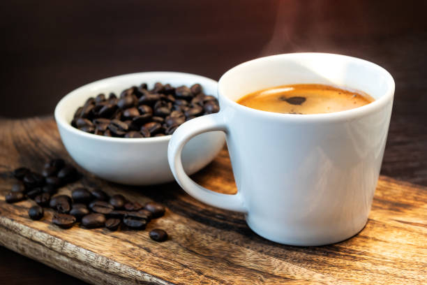 istock Hot black coffee and coffee beans 1383843299