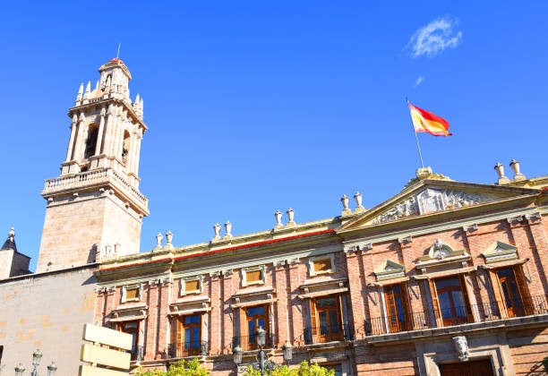 istock Spain flag on a building against a blue sky. 1383843309