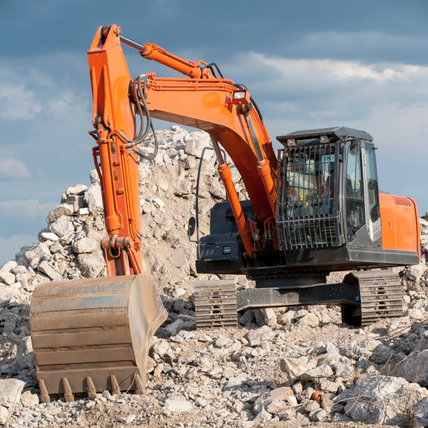 Bagger Square photo of an excavator with sprockets and shovel stands on a pile of rubble
Can you please tell me, where in that picture is a not model released person? I do not see anyone in that picture bagger stock pictures, royalty-free photos & images