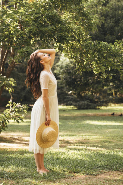 istock Beautiful girl enjoying summer 1383845005