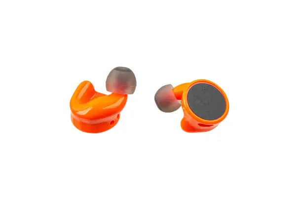 Small modern earplugs with active noise reduction. Safety for hearing. Isolate on a white background.