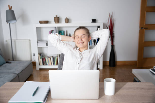 istock Relaxed woman working from home 1383847637