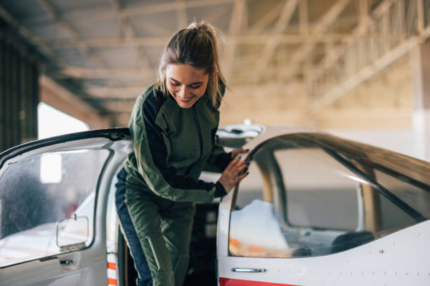 istock Careful female aviator, watching her step after leaving the plane. 1383847847