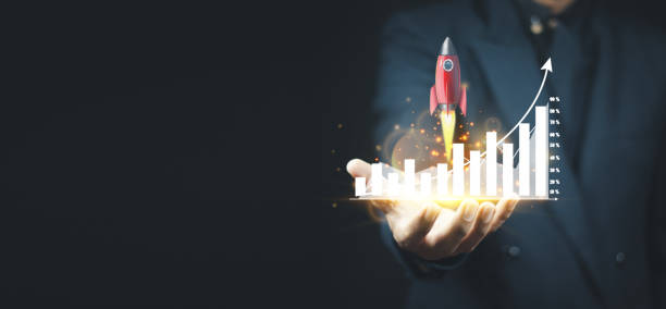 istock Businessman analyzing forex trading charts, financial data. Ideas like rocket 1383849166