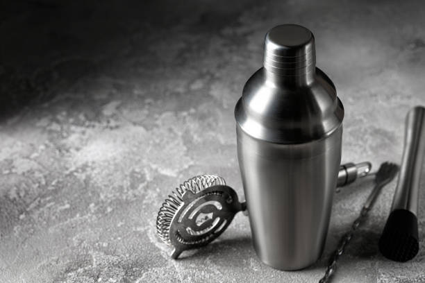 istock Tools for Cocktail. Barman, bartender equipment. Shaker, strainer on grey background 1383850525