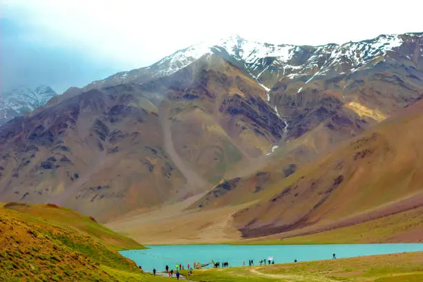 Chandra Tal is a lake in the Lahaul part of the Lahul and Spiti district of Himachal Pradesh. Chandra Taal is near the source of the Chandra River. Despite the rugged and inhospitable surroundings, it is in a protected niche with some flowers and wildlife in summer.