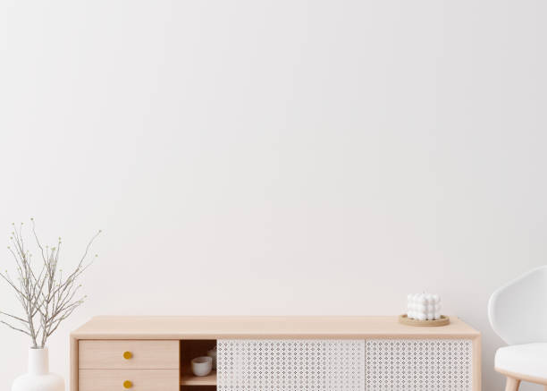 istock Empty white wall. Mock up interior in contemporary style. Close up view. Free space, copy space for your picture, text, or another design. Sideboard, plant. 3D rendering. 1383852016