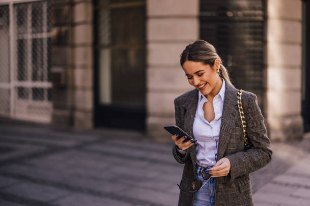 istock Girl at the streets, spending time outside, using the phone. 1383852442