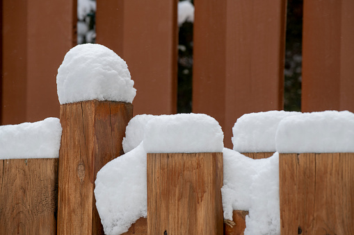 Snow on fence