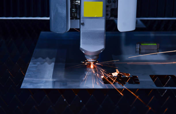 istock Industrial laser cut machine while cutting the sheet metal with the sparking light. 1383852639