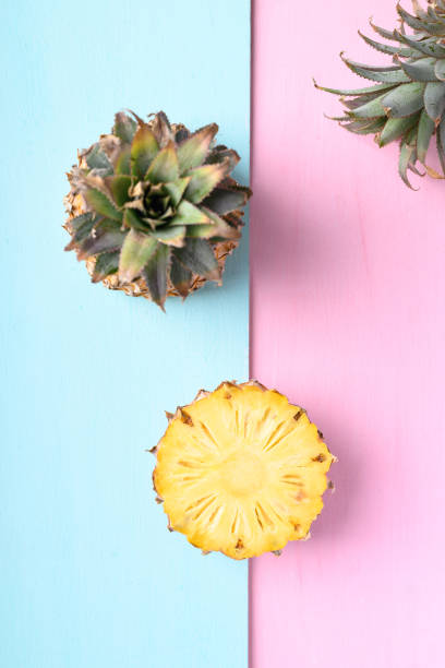 istock Fresh pineapple fruit on pastel color background 1383853689