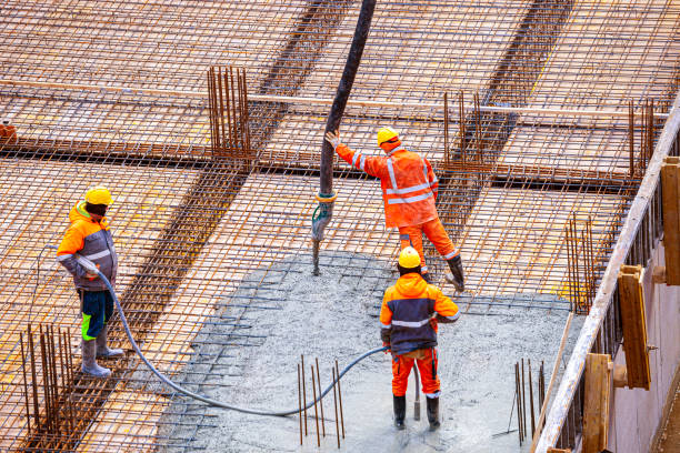 istock Concrete pouring on the construction site. 1383853710