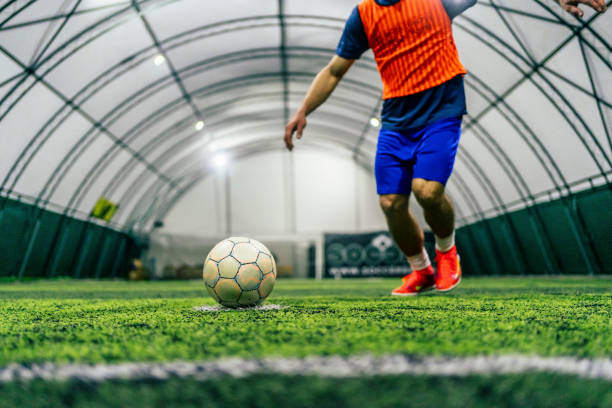 istock Soccer player kicking the ball 1383857121