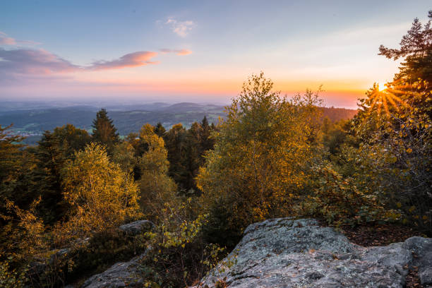 Panorama Landscape and Sunset with View to the Mountains of the German Alps with Sea of Fog on Geisslinger Stein near Ruselabsatz near Koenigsstein in Bavarian Forest, Germany Panorama Landscape and Sunset with View to the Mountains of the German Alps with Sea of Fog on Geisslinger Stein near Ruselabsatz near Koenigsstein in Bavarian Forest, Germany bavarian forest stock pictures, royalty-free photos & images