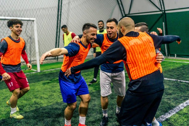 istock Soccer players celebrating a victory 1383858537