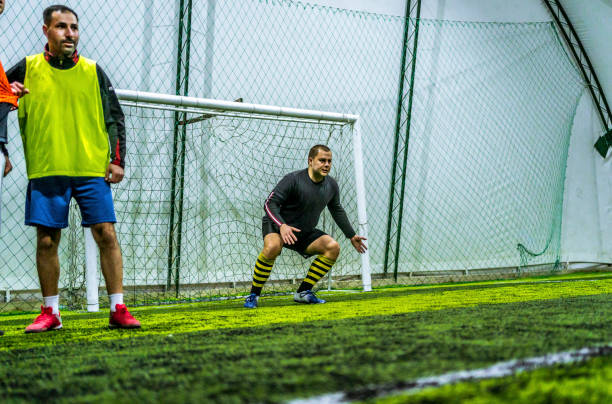 istock Goalkeeper defending goal in soccer game 1383859072