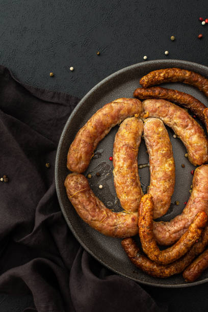 istock Baked pork sausages with spices 1383859398