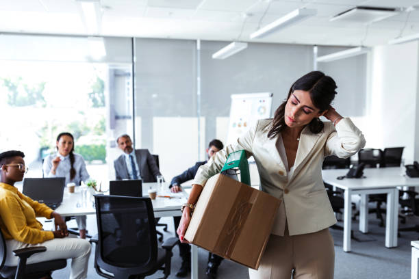 Mid adult businesswoman with cardboard box being fired Stress of business woman packing brown cardboard box her belonging after resign and signing cancellation contract letter, Change of job unemployment or resignation concept firing stock pictures, royalty-free photos & images