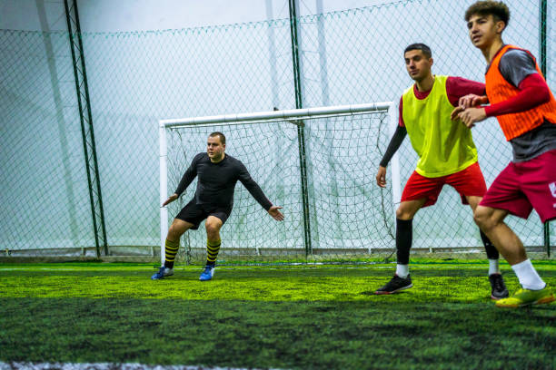 istock Goalkeeper defending goal in soccer game 1383861021